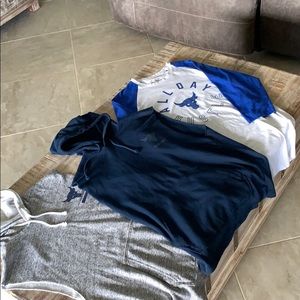 Three Men’s UA Project Rock Athletic shirts